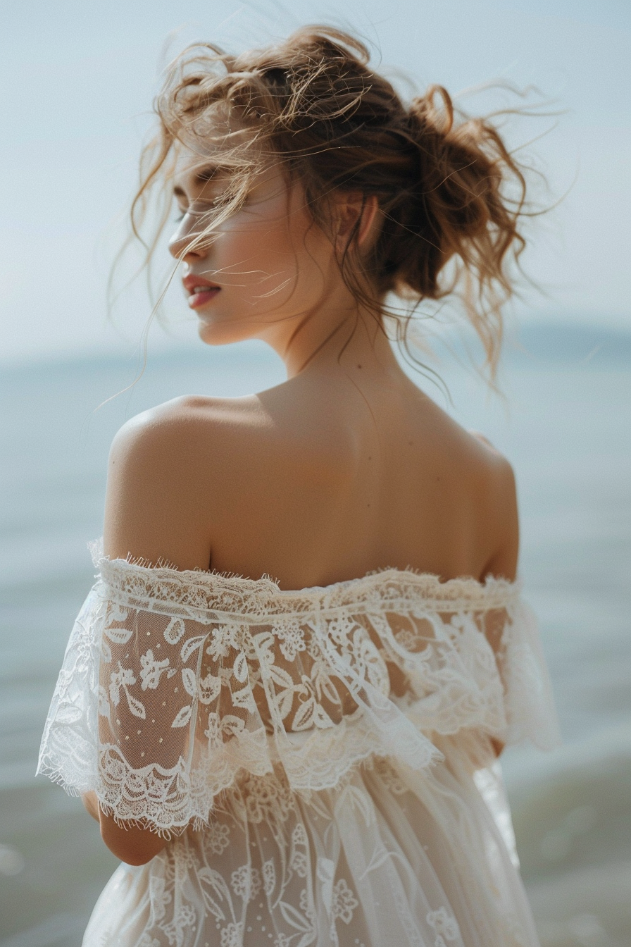 Beach wedding outfit. Flowy off-shoulder ivory dress with delicate lace details.