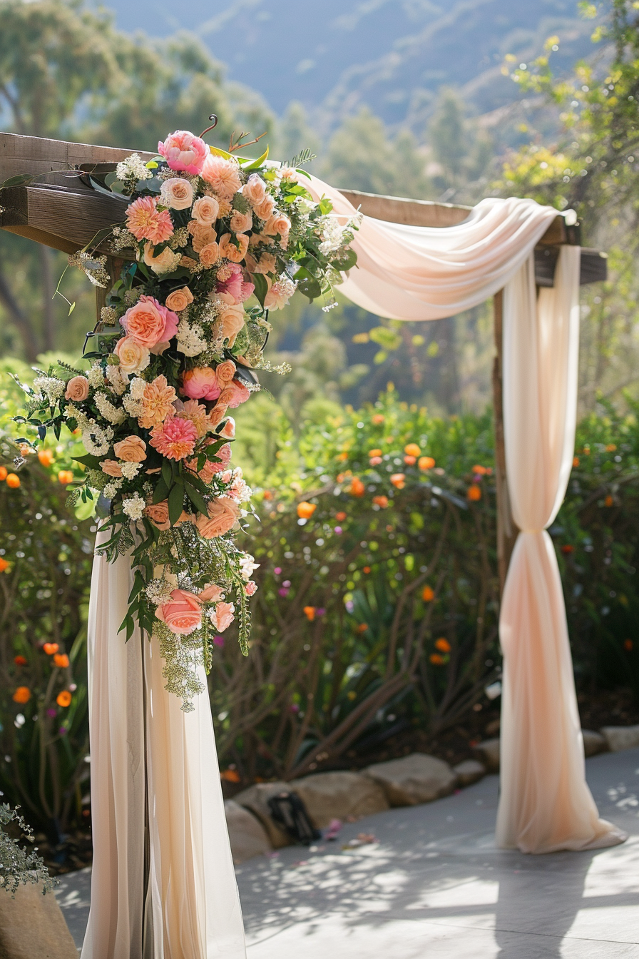 Wedding view. flowing fabric archway's draped in flowers with wooden accents.