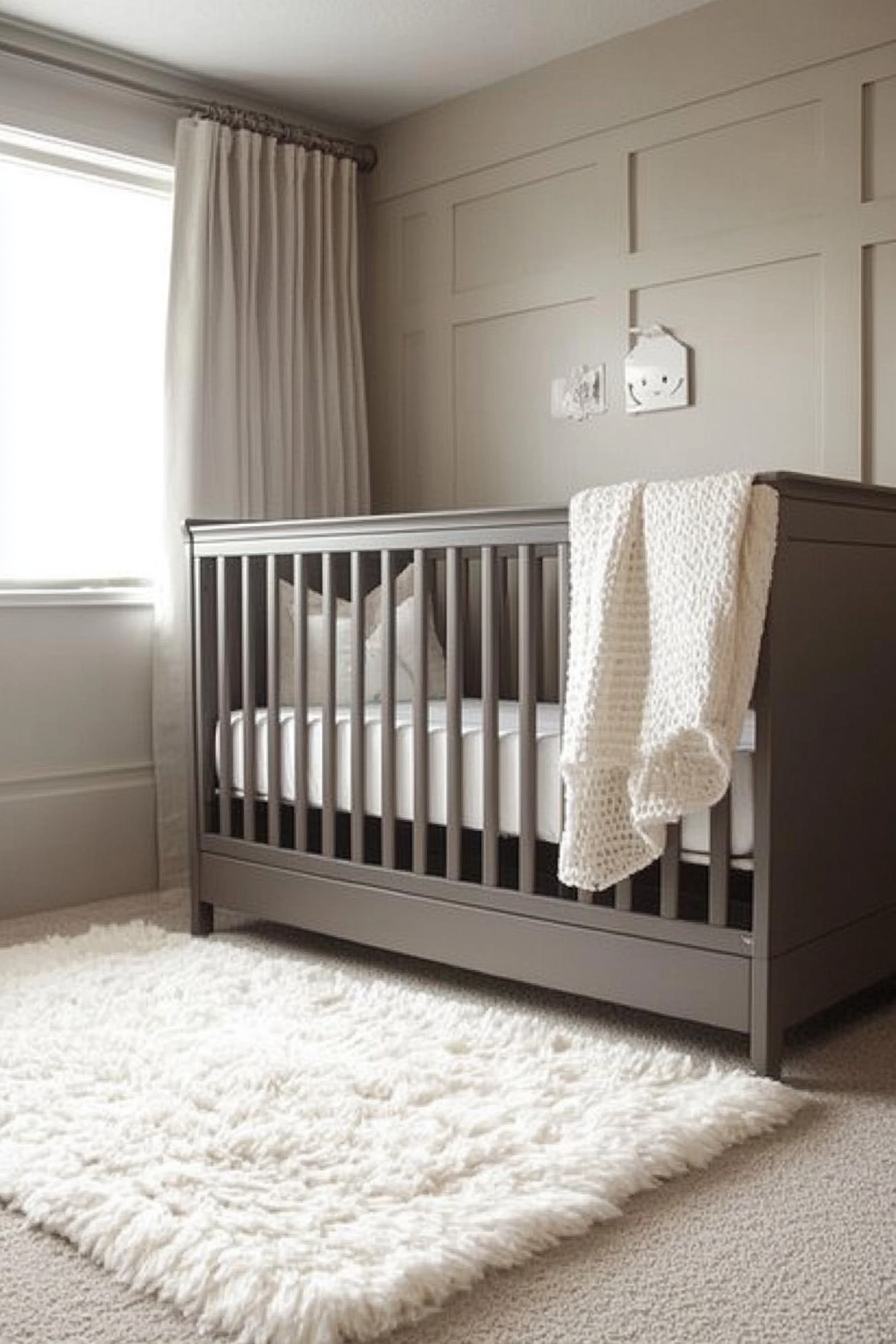 Neutral nursery. Compact grey crib, beige walls, plush white rug.