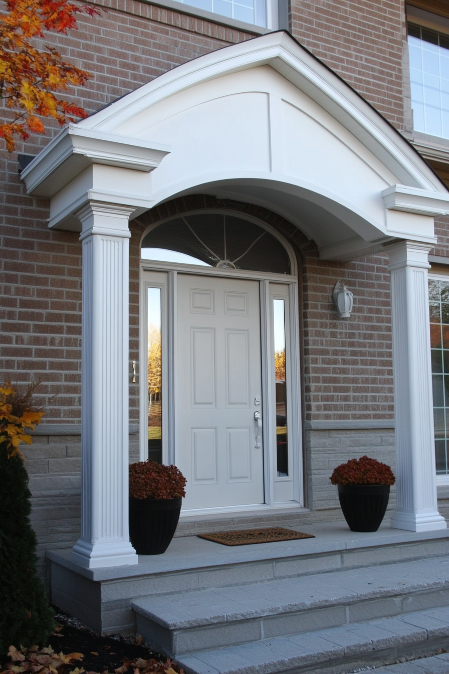 Front Porch Design. Colonial-style door with adjacent planters.