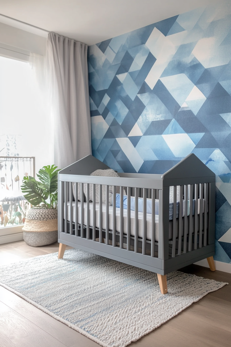 Contemporary baby room. Grey crib with sky-blue geometric wall mural.